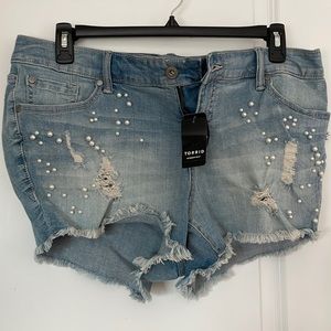 Torrid denim shorts with rips and pearls Size 16